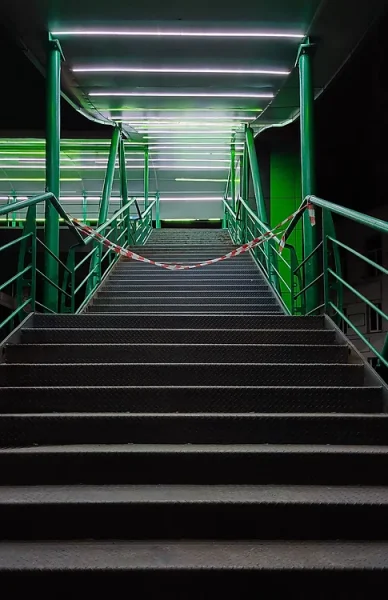 night-stairs-with-iron-railings-pedestrian-bridge-are-illuminated-by-green-lanterns